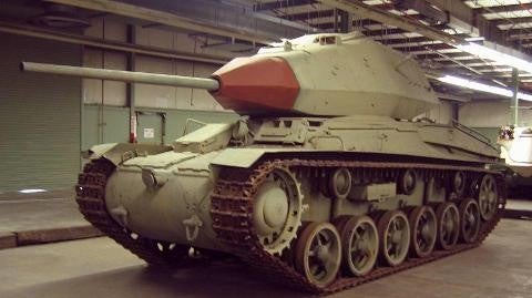 Museum with tank inside building facing left